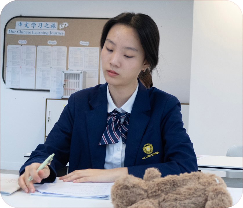 Students in knit cardigans studying in class